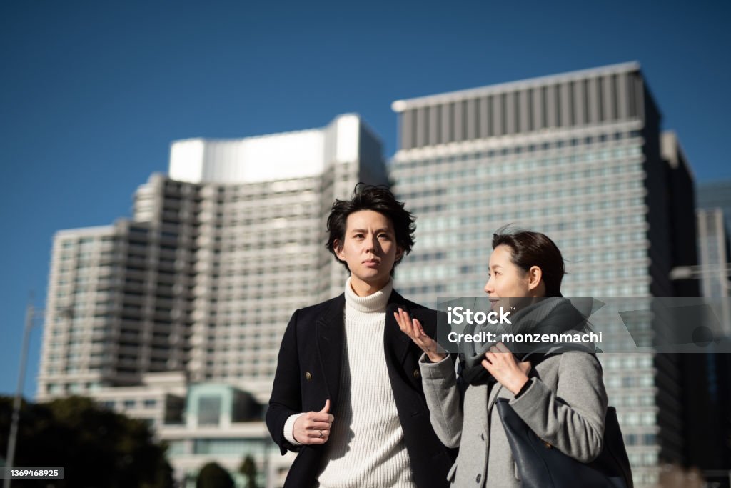 Two business people talking in business district 30-34 Years Stock Photo