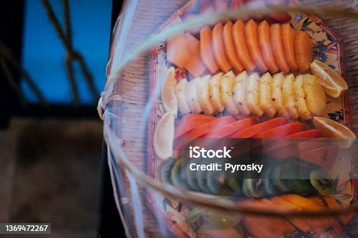 istock Slices of tropical fruit covered with a mesh lid 1369472267