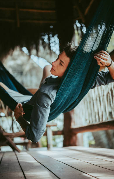 istock A Young Handsome Man In A Hammock In A Magical Bamboo House 1369472372