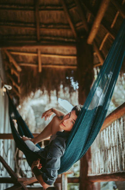 istock A Young Handsome Man In A Hammock In A Magical Bamboo House 1369472389