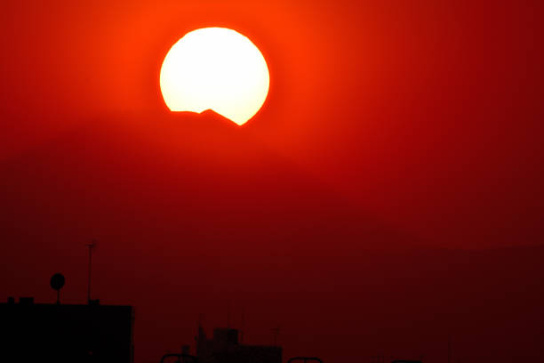 The view of sunset at the top of Mt. Fuji, as observed from the residential area of Tokyo (Setagaya Ward). Mt. Fuji is located about 100km away from this site of Tokyo.Mt. Fuji is designated as UNESCO World Heritage site.This kind of scenery can be observed in early February from Setagaya Ward.