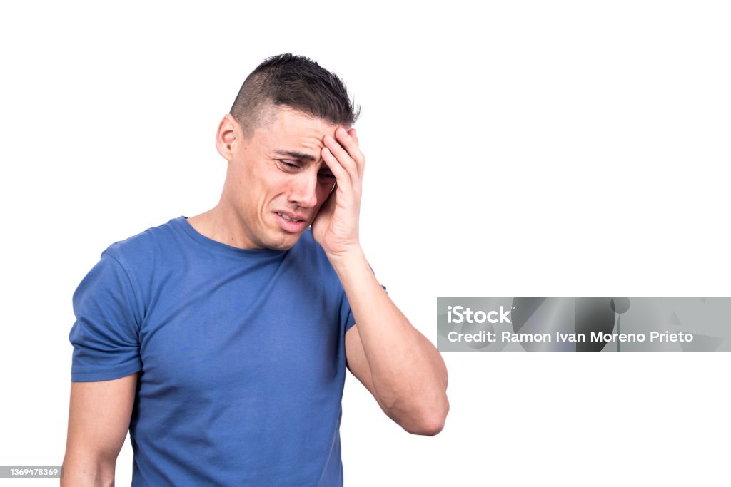 Man with his hand on his head crying Studio photo with white background of a man with his hand on his head crying Men Stock Photo
