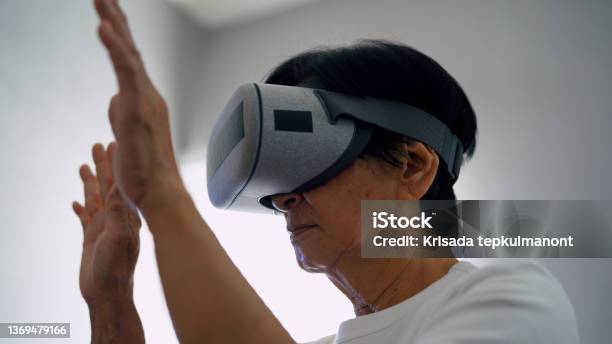 The Metaverse Learning And Using Innovation Stock Photo - Download Image Now - 60-69 Years, 65-69 Years, Active Lifestyle