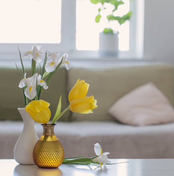 istock white home interior with spring flowers and decorations 1369479290
