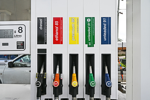 Petrol pump filling nozzles. Fuel at gas station close up