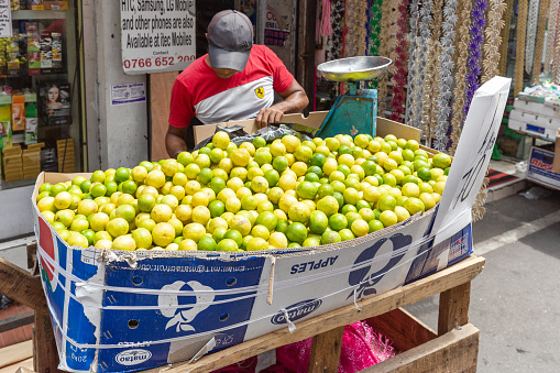 Colombo, Sri Lanka - February 5, 2020: A vendor sells lemons at a street market in Colombo