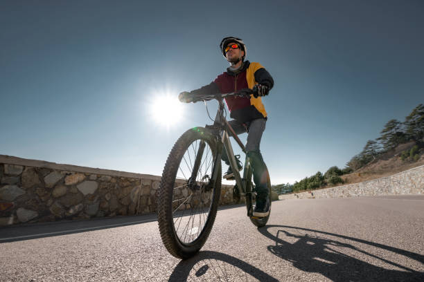 istock Cyclist riding bike on open road. Concept active sport 1369486122