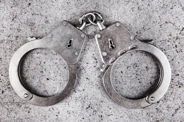 istock Handcuffs on the Metal 1369487427