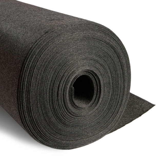 istock A roll of dark gray woollen fabric on a white background. 1369488631