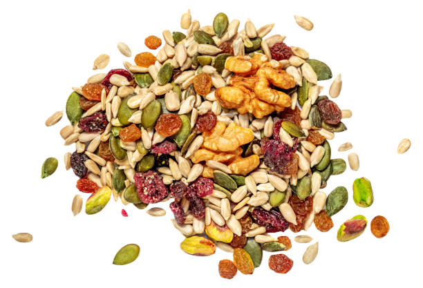 istock Nuts, seeds and dried fruits isolated on white background. Flat lay. Top view 1369490798