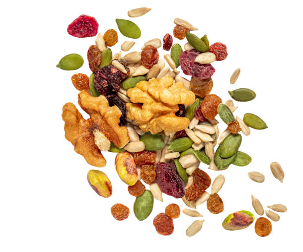 istock Nuts, seeds and dried fruits isolated on white background. Flat lay. Top view 1369490870
