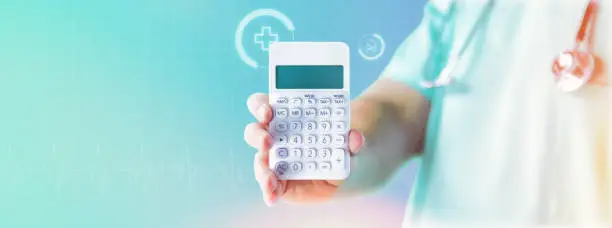 Photo of Doctor with calculator on blue background