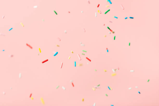 istock flying colorful sprinkles over pink background 1369494279