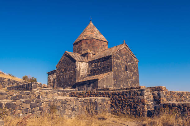 istock Scenic view of an old Sevanavank church in Sevan. Blue sky and bright autum colors on the sunny day. Ancient temple stock photography. 1369496626