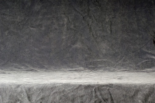 Gray textured crumpled velvet background