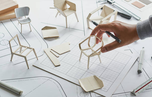 istock Designer sketching drawing design development product plan draft chair armchair Wingback Interior furniture prototype manufacturing production. designer studio concept . 1369499774