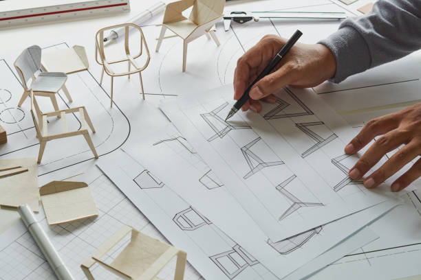 istock Designer sketching drawing design development product plan draft chair armchair Wingback Interior furniture prototype manufacturing production. designer studio concept . 1369499775