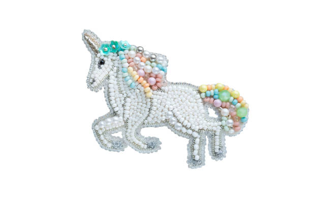 istock Brooch handmade made of multicolored beads on the background 1369505861