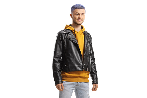 Young man with blue hair wearing jeans and leather jacket isolated on white background