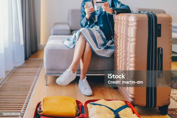 Tourist In Hotel Room Flight Reservations Stock Photo - Download Image Now - Making a Reservation, Travel, Vacations