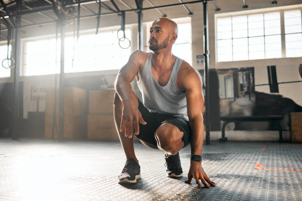 istock Shot of a young man taking a break during his workout routine 1369509408