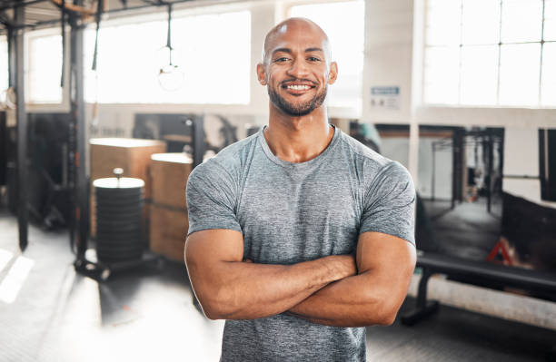 Shot of a handsome young man taking a break during his workout