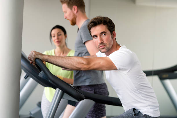 istock Fit people working out at the gym 1369509429