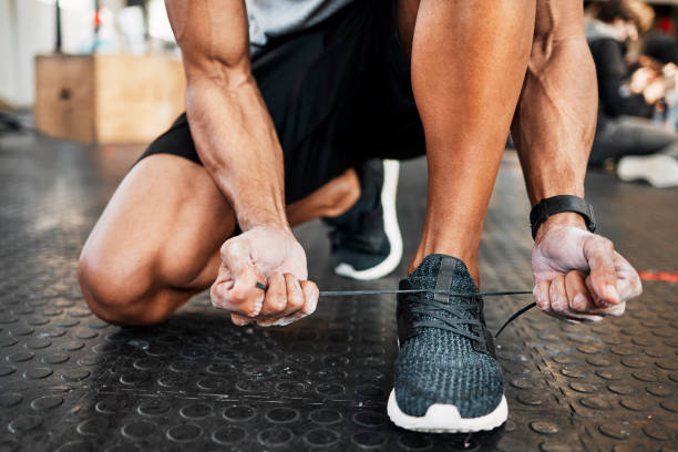 istock Shot of a man tying his laces before a workout 1369509436