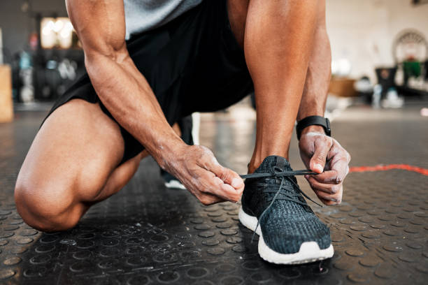istock Shot of a man tying his laces before a workout 1369509441