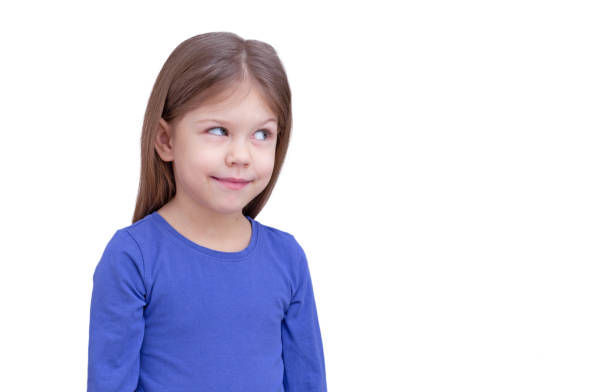 istock Smiling little girl looking aside at something 1369510151