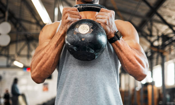 man using a kettlebell during his workout ripl fitness