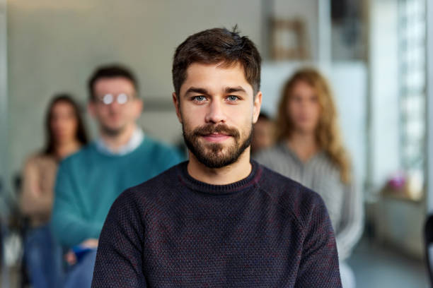 istock Young creative man during an education event in the office. 1369511460