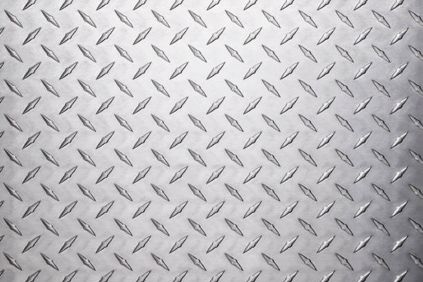 istock light aluminum plate background, silver metal with a diamond texture. 1369511981