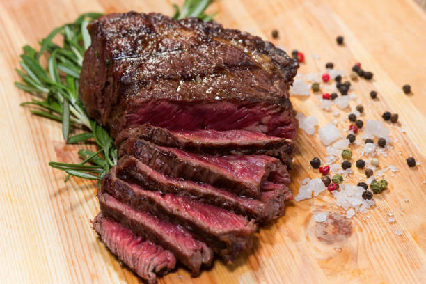 istock Baked meat on a wooden board.