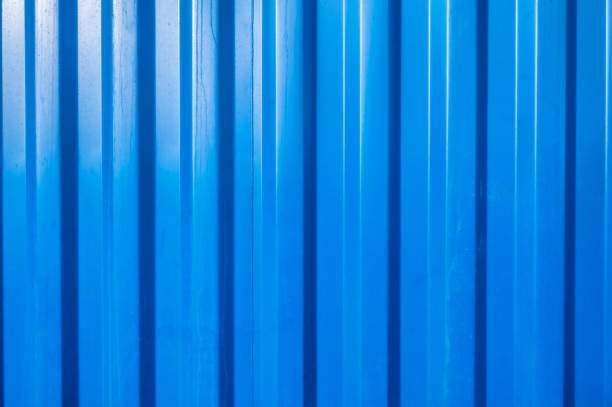 istock Blue container wall with corrugated metal as background with text free space 1369515393