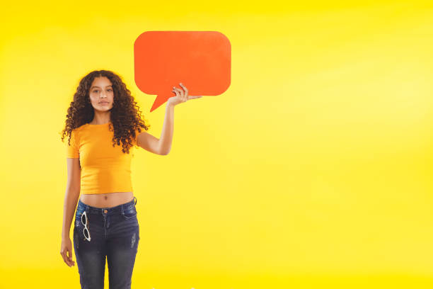 istock Teenager holding a sign 1369515677