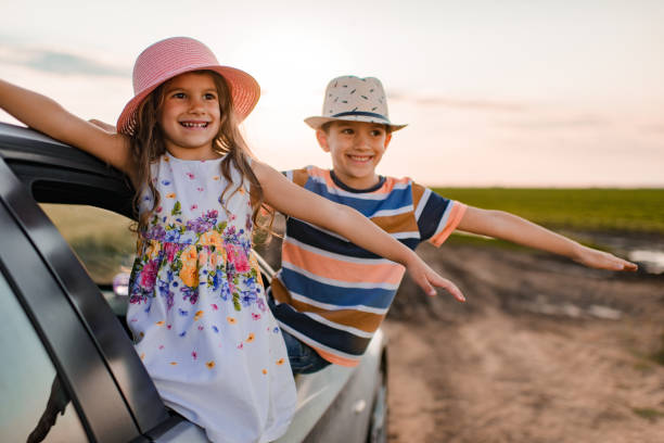 istock Beautiful children enjoying on a road trip 1369516192
