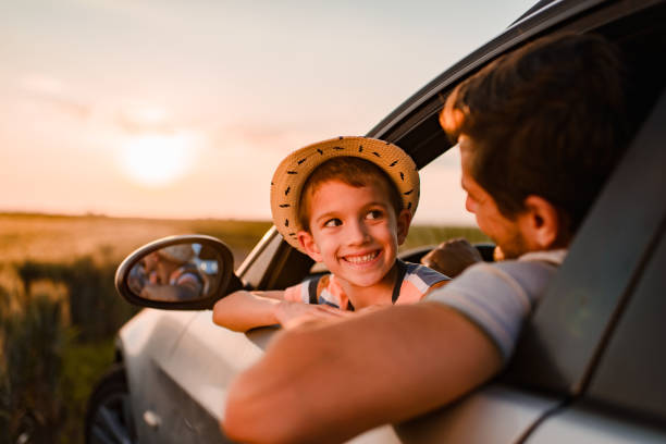 istock Beautiful father and son enjoying on a road trip 1369516933
