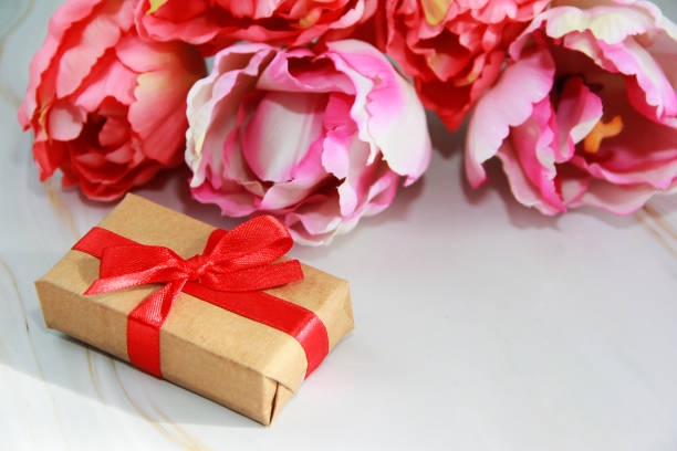 flowers pink tulips and gift a box