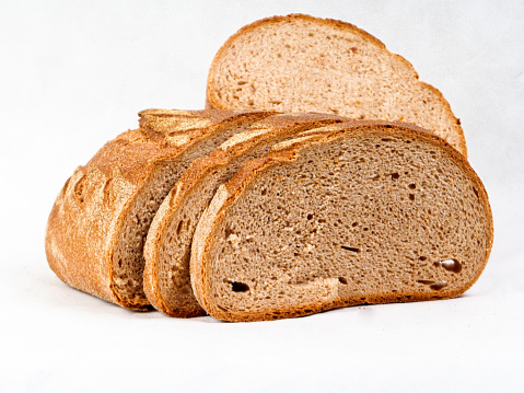 Close-up with the crust of homemade sourdough bread. Delicious loaf of bread, macro details, top view