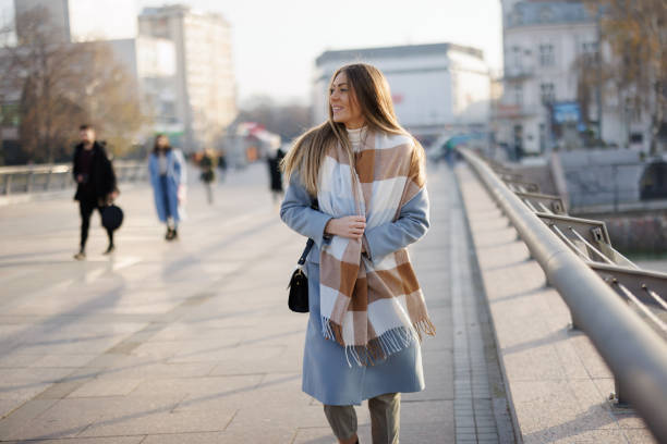 istock Female pedestrian on city bridge 1369521285