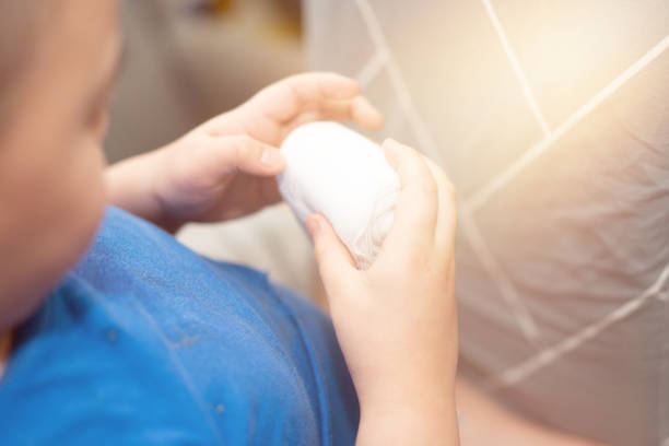 istock Bandage texture with child hold for medicine wound care 1369522504