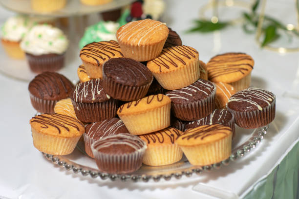 istock Tasty chocolate cupcakes on stand, closeup. 1369527082