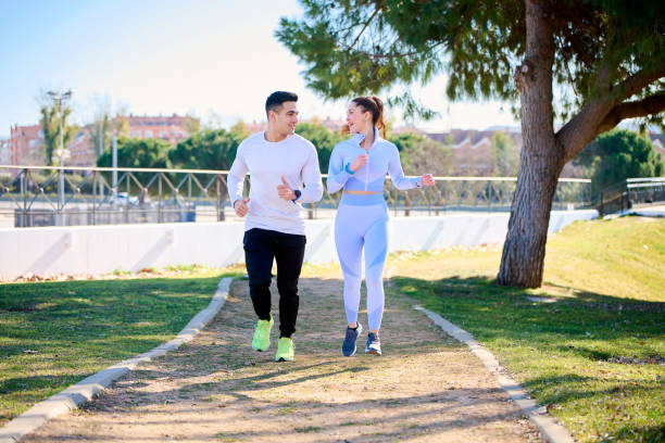 istock Young couple practicing sports outdoors 1369528395