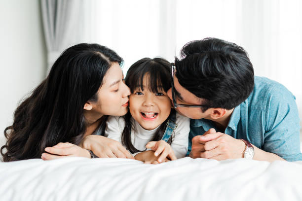 istock small asian family portrait at home 1369528443