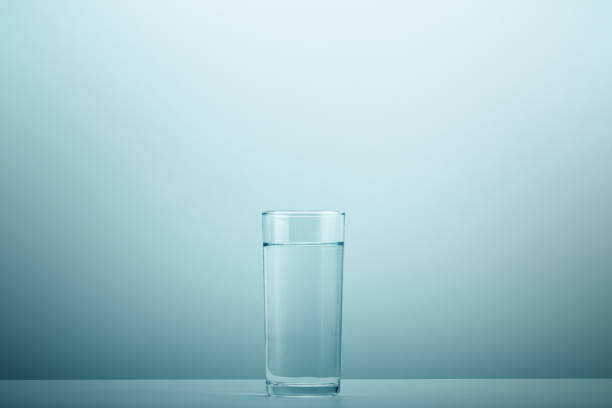 The Clear water drop on cool water bottle on table