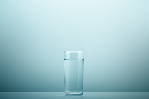 Glass of mineral sparkling water isolated on white background.