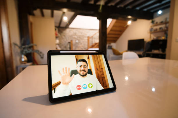 istock Man on a videocall on a tablet screen 1369529908