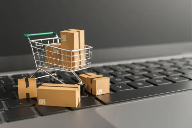 Photo of close up of shopping cart on top of computer keyboard