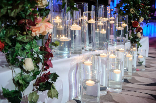 istock transparent glasses with candles in interiors 1369531037